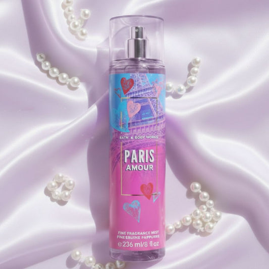 Bath & Body Works Paris Amour fragrance mist bottle on a soft purple background with pearls.