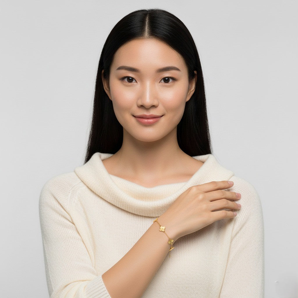 Woman wearing a cream sweater against a light gray background