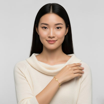 Woman wearing a cream sweater against a light gray background