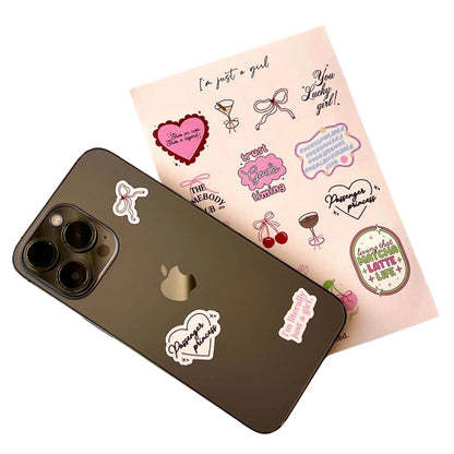 Phone case with stickers and a sheet of additional stickers on a white background