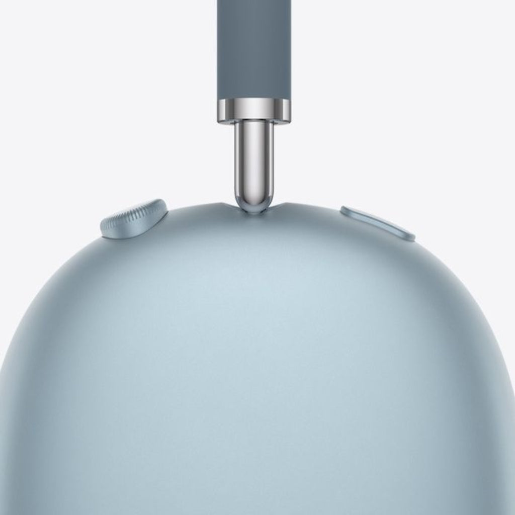 Close-up of a light blue kitchen mixer with a gray handle on a white background