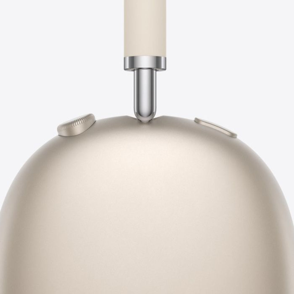 Close-up of a beige pendant light with a white shade on a white background