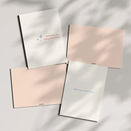 Four greeting cards with text on a light background