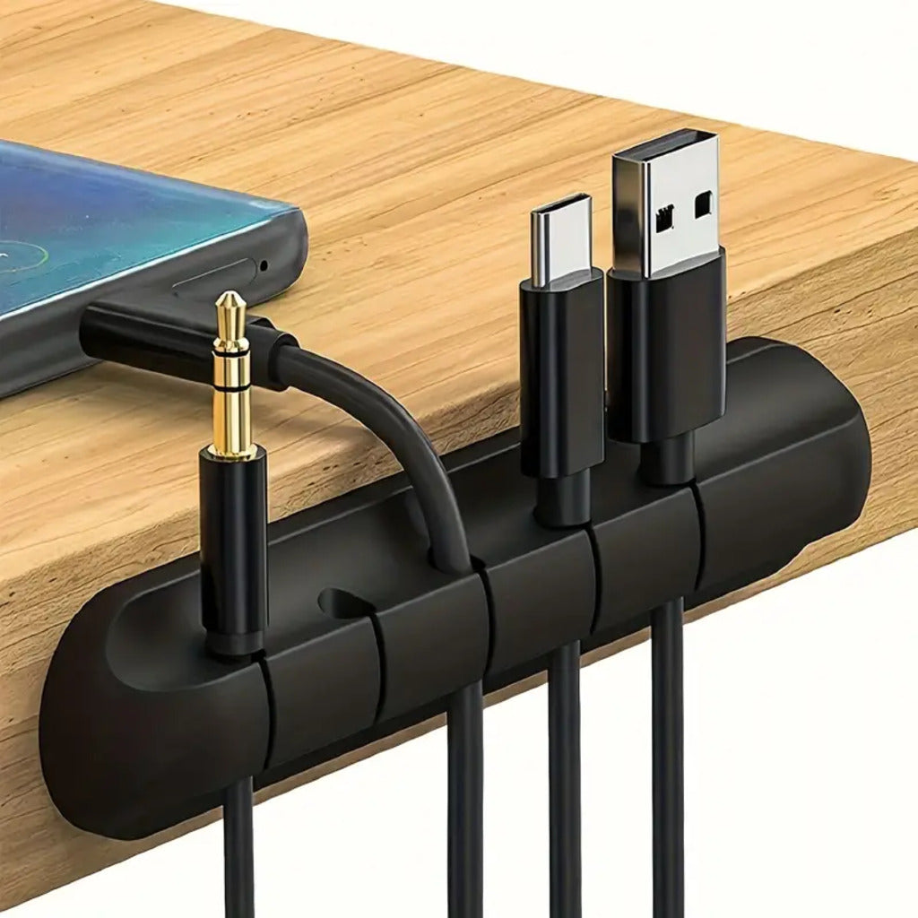Black cable organizer with phone, USB, and audio cable on a wooden surface