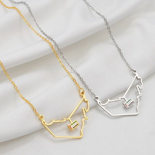 Two necklaces shaped like ski lifts on a white background